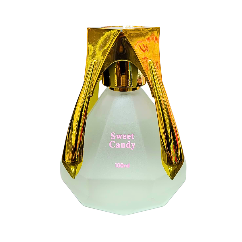 A photo of a 100ml bottle of Sweet Candy Perfume. The bottle is clear glass with a faceted diamond shape and a gold cap and base. The label reads "Sweet Candy."